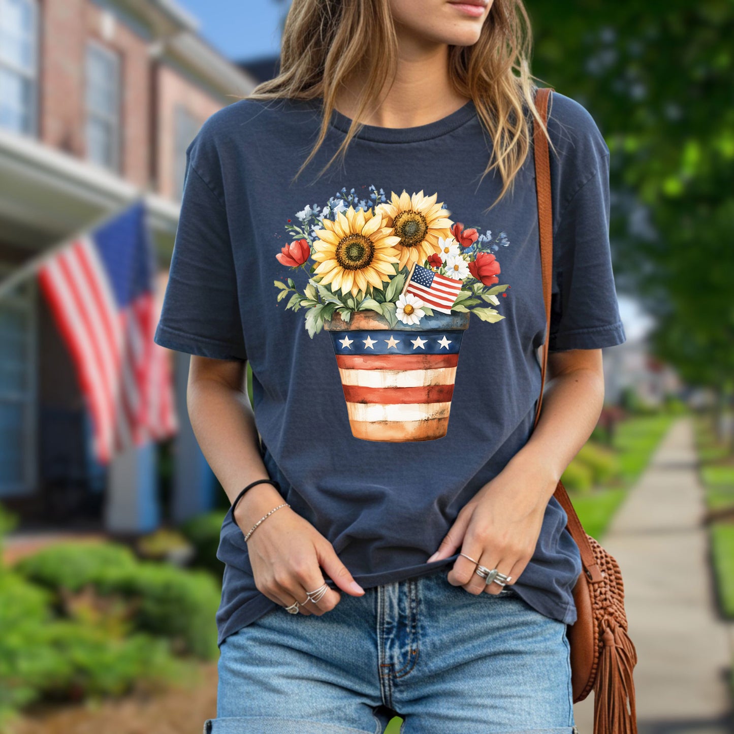 Garment-dyed navy t-shirt with a patriotic sunflower bouquet in a star-striped pot and a small American flag.