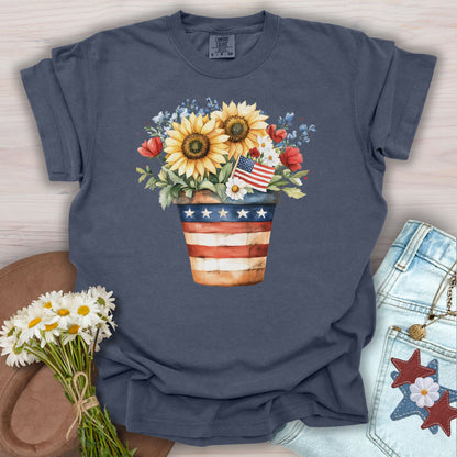 Denim S t-shirt with a patriotic sunflower bouquet in an American flag pot, featuring a small flag.