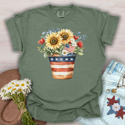 Moss green t-shirt with a patriotic sunflower bouquet in a flag-decorated pot.