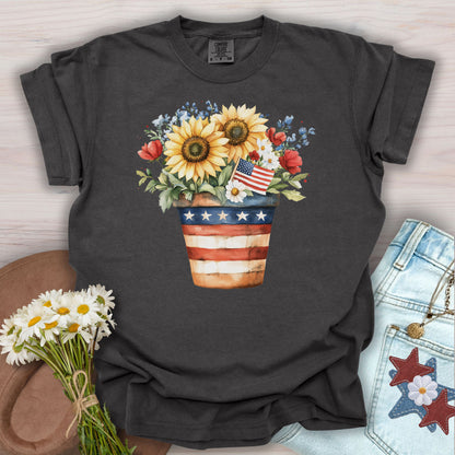 Pepper S t-shirt with a patriotic sunflower bouquet in an American flag pot, daisies, and blue forget-me-nots.
