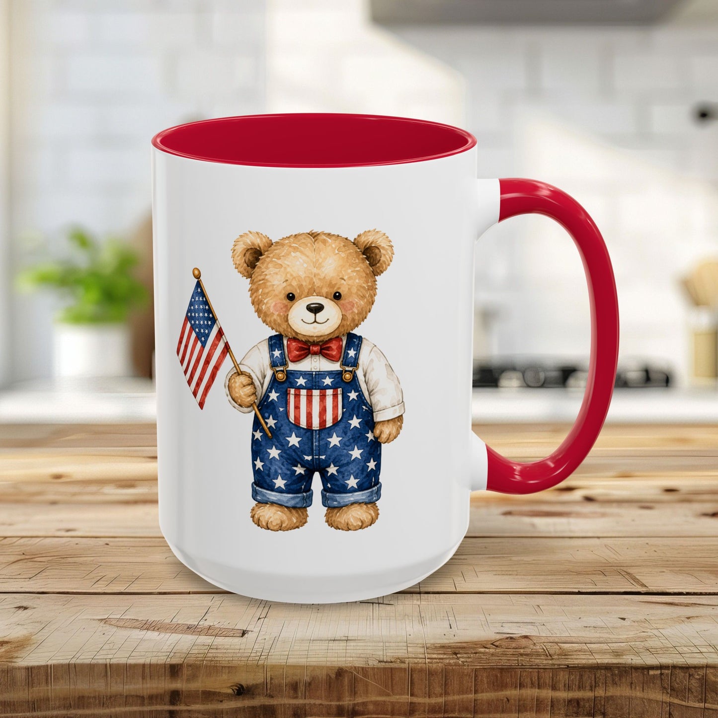 15oz ceramic mug with a red handle and interior, featuring a watercolor teddy bear in star-spangled overalls holding a flag.