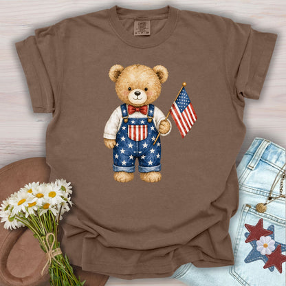 Espresso S t-shirt with a hand-drawn teddy bear in Americana overalls holding a US flag.