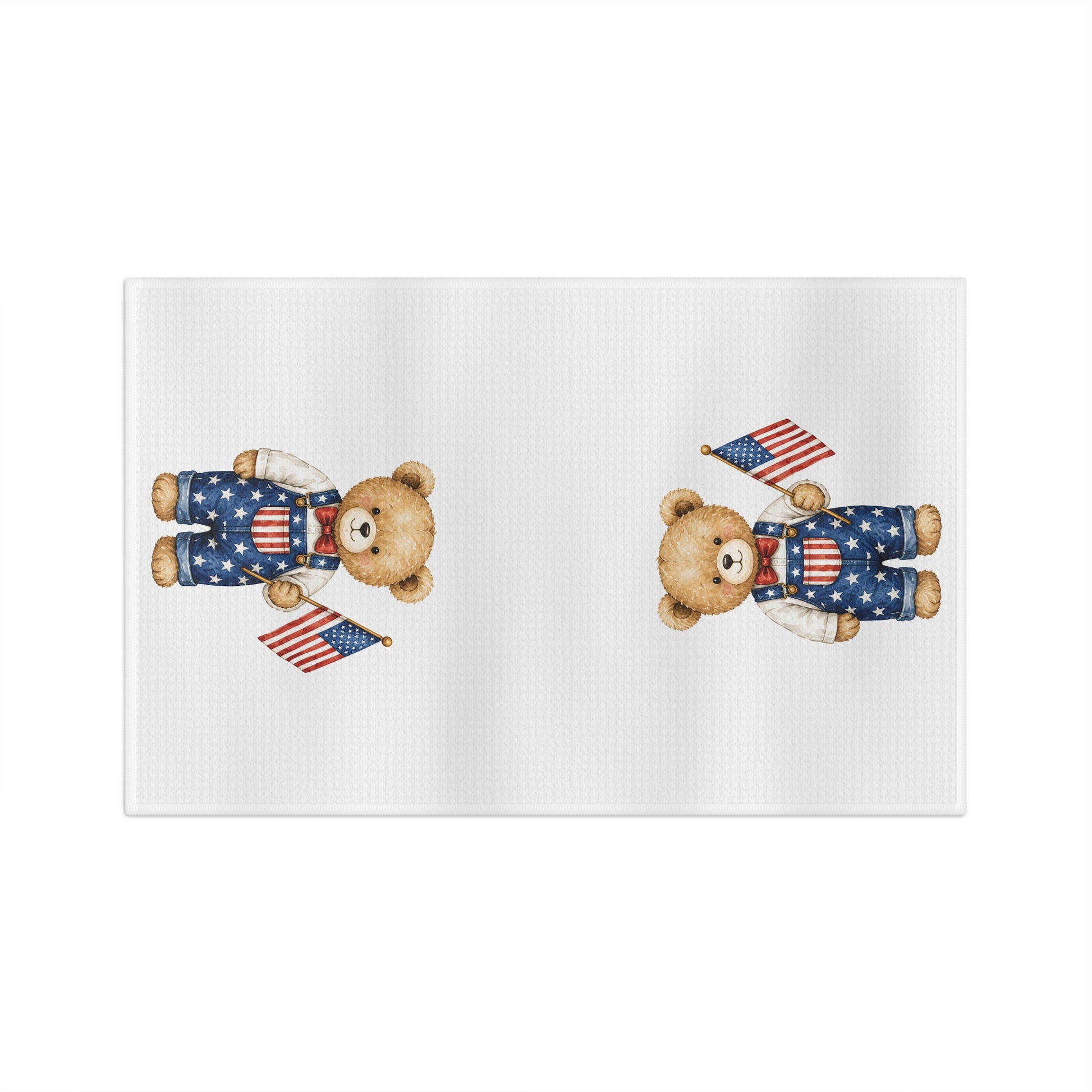 Watercolor-style teddy bears in star-spangled overalls holding American flags on a white microfiber tea towel.