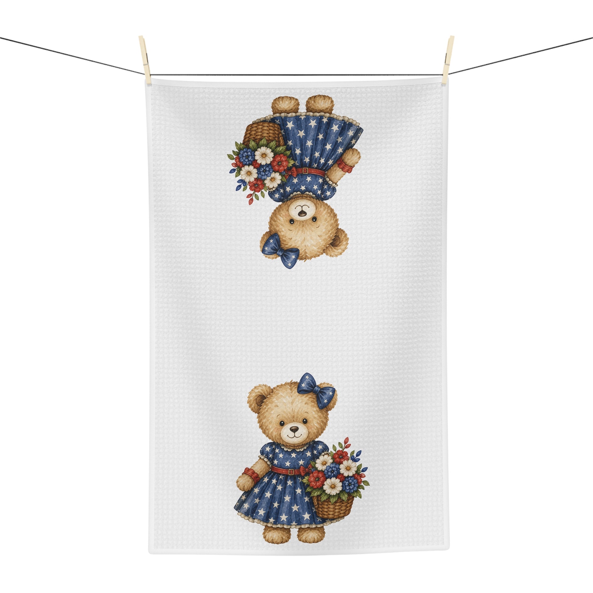 Microfiber tea towel with two patriotic teddy bears in star-dotted dresses, holding red, white, and blue floral baskets.