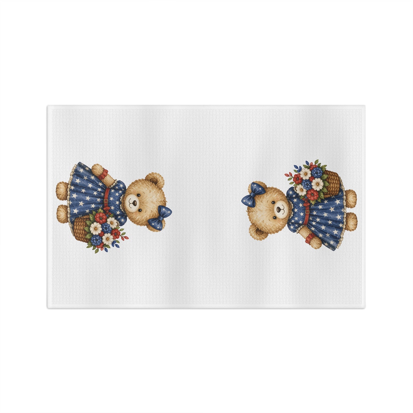 White microfiber tea towel with two teddy bears in star-dotted navy dresses holding red, white, and blue floral baskets.