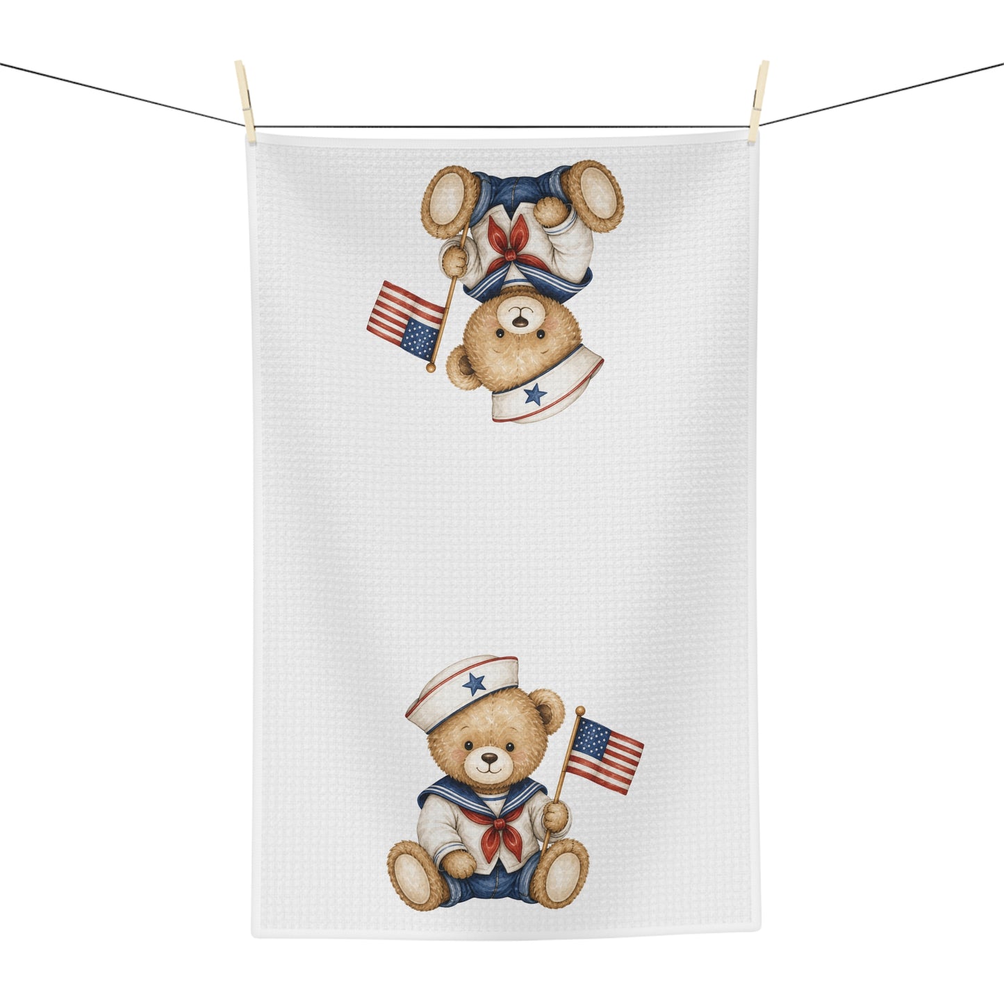 White microfiber tea towel with two hand-drawn patriotic sailor teddy bears holding American flags.