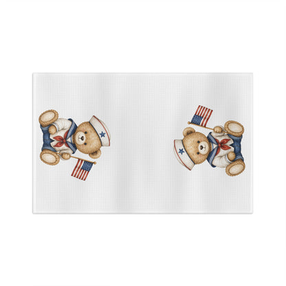White microfiber tea towel with two patriotic teddy bear sailors holding American flags.