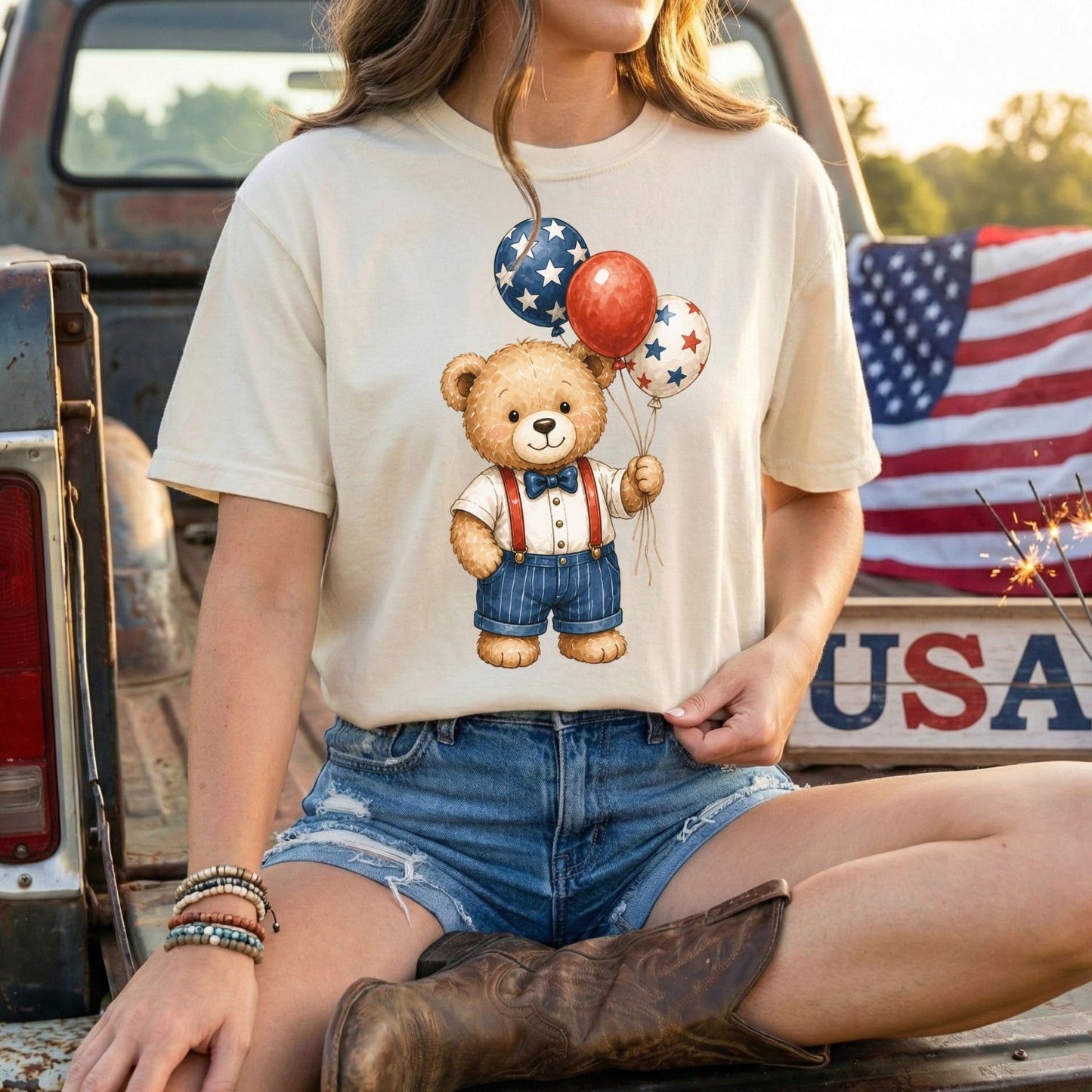Relaxed-fit, garment-dyed t-shirt with a vintage teddy bear holding red, white, and blue star balloons.