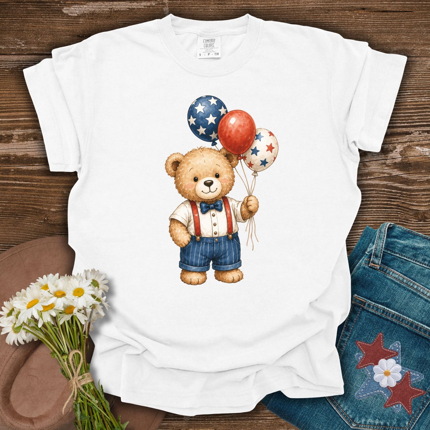 White S-size cotton tee with a vintage teddy bear holding red, white, and blue star balloons.