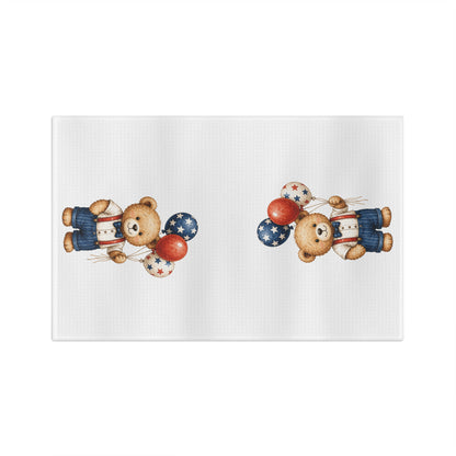 White microfiber tea towel with two vintage-style teddy bears holding red, white, and blue star balloons.