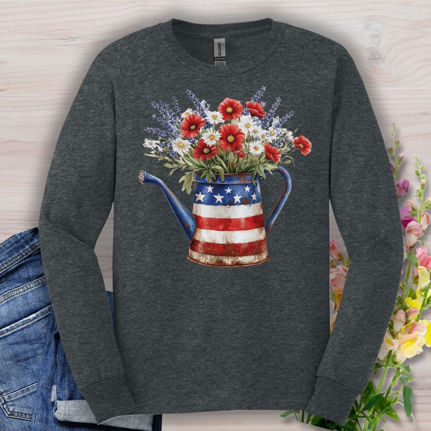 Dark Heather long sleeve tee with a rustic patriotic watering can holding red poppies, white daisies, and lavender.