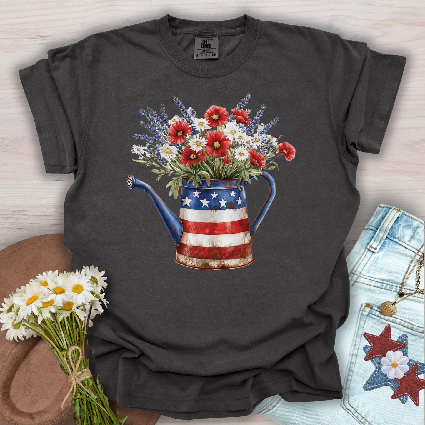 Pepper S t-shirt with patriotic watering can overflowing with lavender, daisies, and poppies.