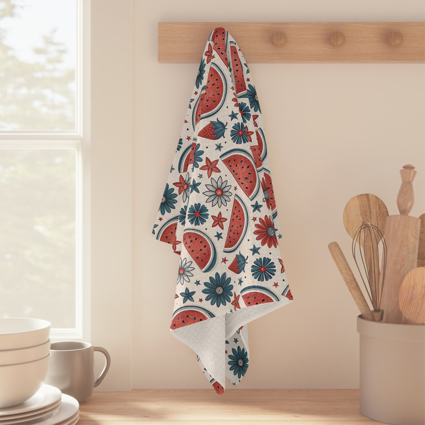 Patriotic microfiber tea towel with watercolor watermelon slices and floral motifs in red, teal, and white.