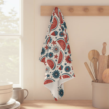 Patriotic microfiber tea towel with watercolor watermelon slices and floral motifs in red, teal, and white.