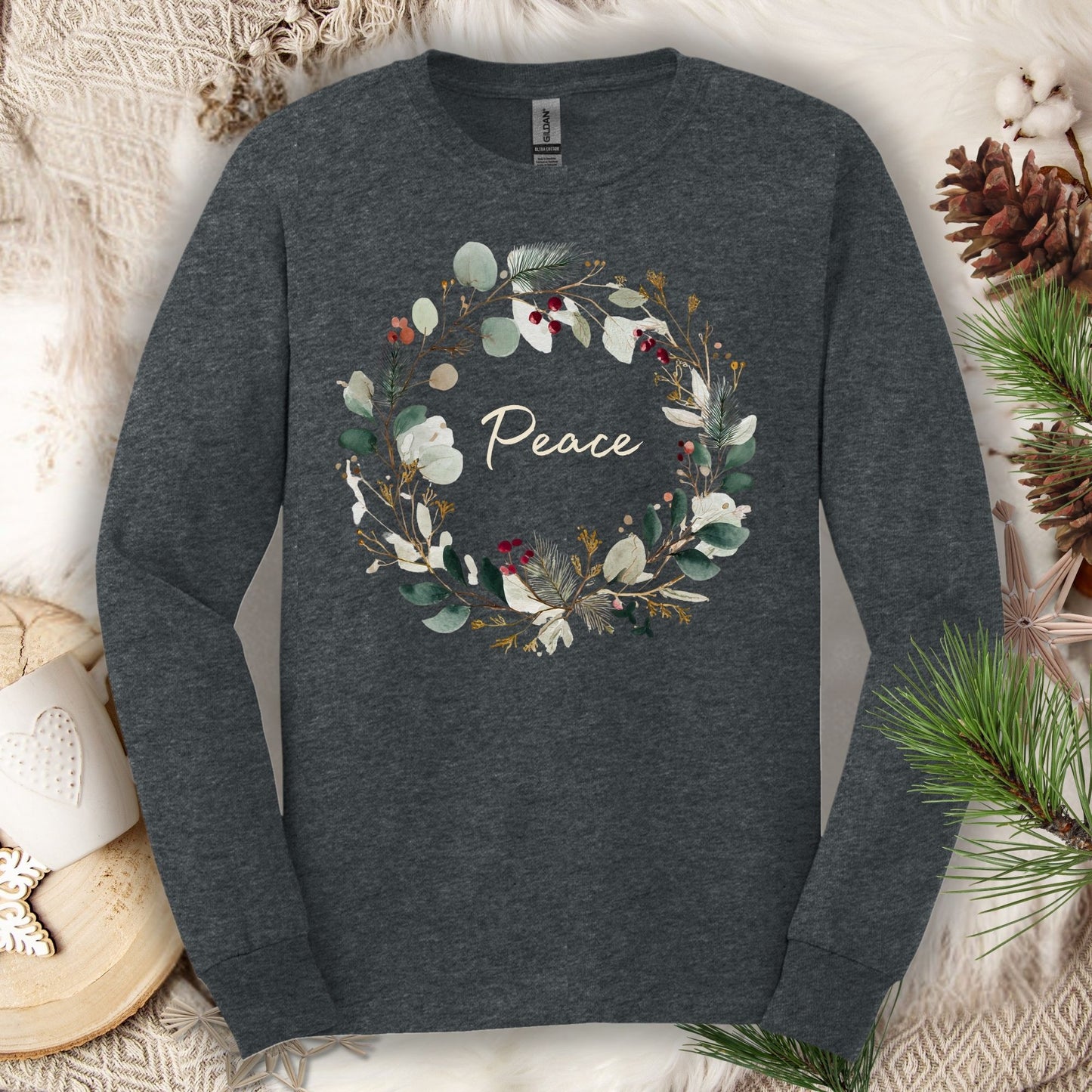 Dark heather long sleeve tee with a watercolor "Peace" Christmas wreath design.