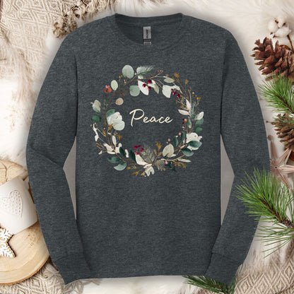 Dark heather long sleeve tee with a watercolor "Peace" Christmas wreath design.