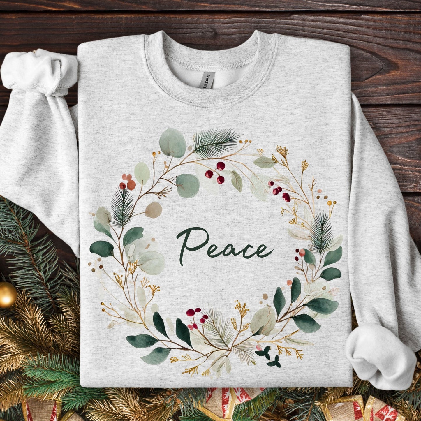 Ash heavyweight cotton sweatshirt with watercolor Christmas wreath and "Peace" in green.