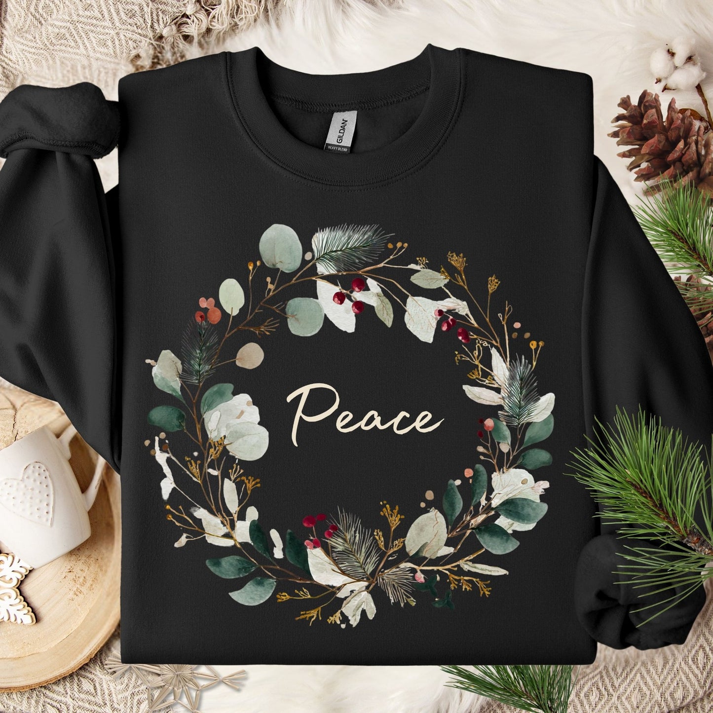 Black cotton sweatshirt with "Peace" in a watercolor Christmas wreath design.