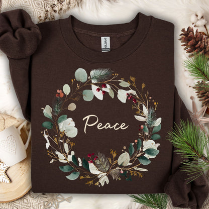 Dark Chocolate Peace Christmas Wreath Sweatshirt with watercolor wreath and red berries.