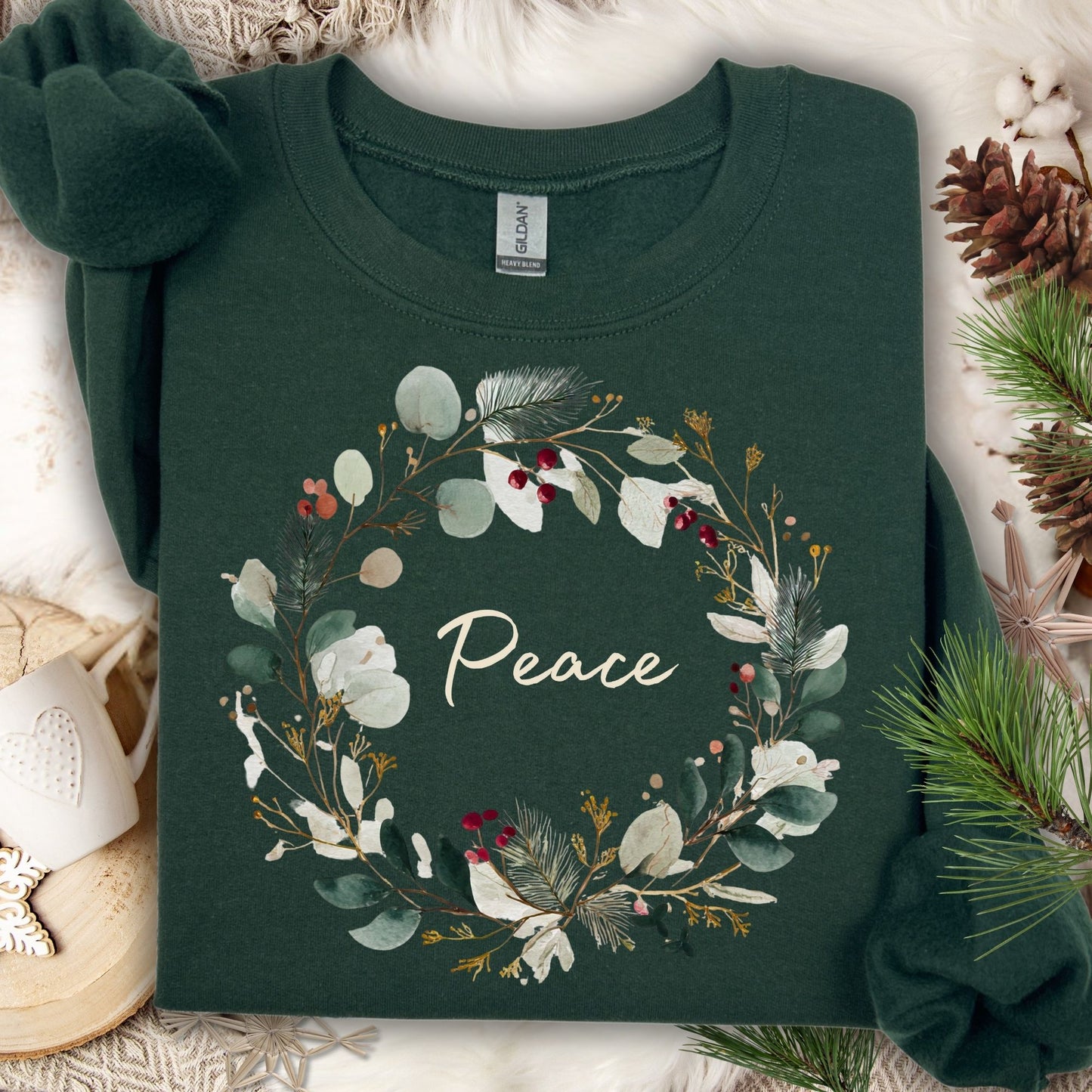 Forest Green Peace Christmas Wreath Sweatshirt with watercolor design and red berries.