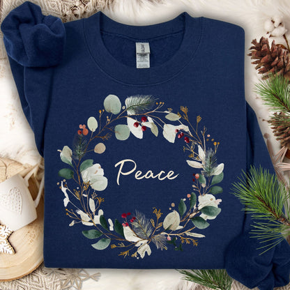 Navy S sweatshirt with watercolor Christmas wreath and "Peace" text.