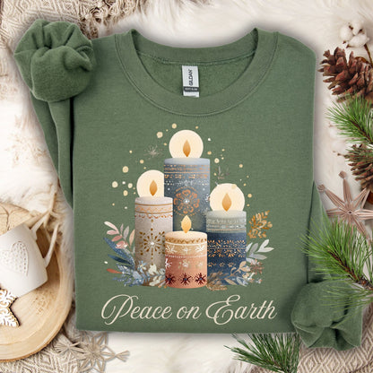 Sage green Gildan sweatshirt with watercolor Nordic advent candles and "Peace on Earth" text.