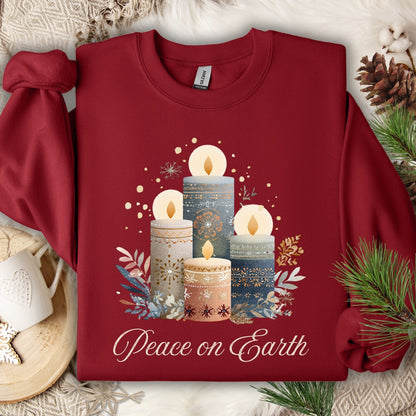 Garnet sweatshirt with Nordic-style advent candles, winter foliage, and "Peace on Earth" in muted tones.