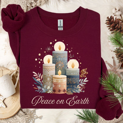 Maroon Gildan sweatshirt with Nordic-style advent candles, winter foliage, and "Peace on Earth" design.