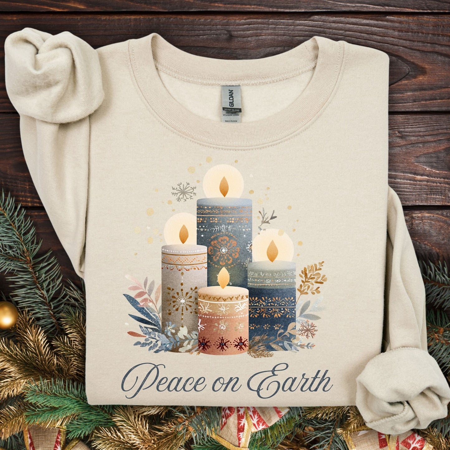 Sand Gildan sweatshirt with watercolor Nordic advent candles and "Peace on Earth" text.