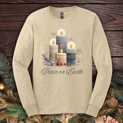 Sand Gildan long sleeve tee with folk art Nordic advent candles and "Peace on Earth" text.