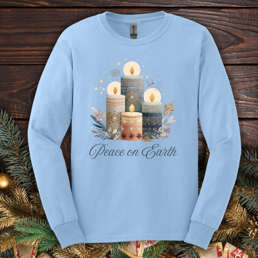 Light blue Gildan long sleeve tee with folk art Nordic advent candles and "Peace on Earth" text.