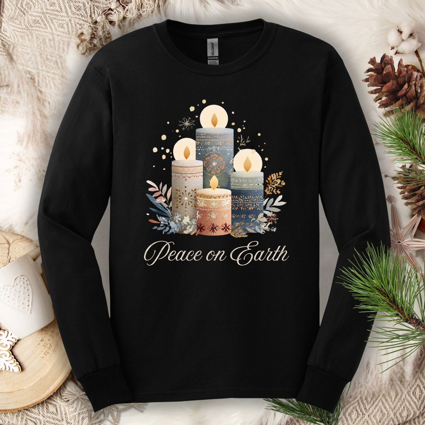 Black Gildan long sleeve tee with folk art Nordic advent candles and "Peace on Earth" text.