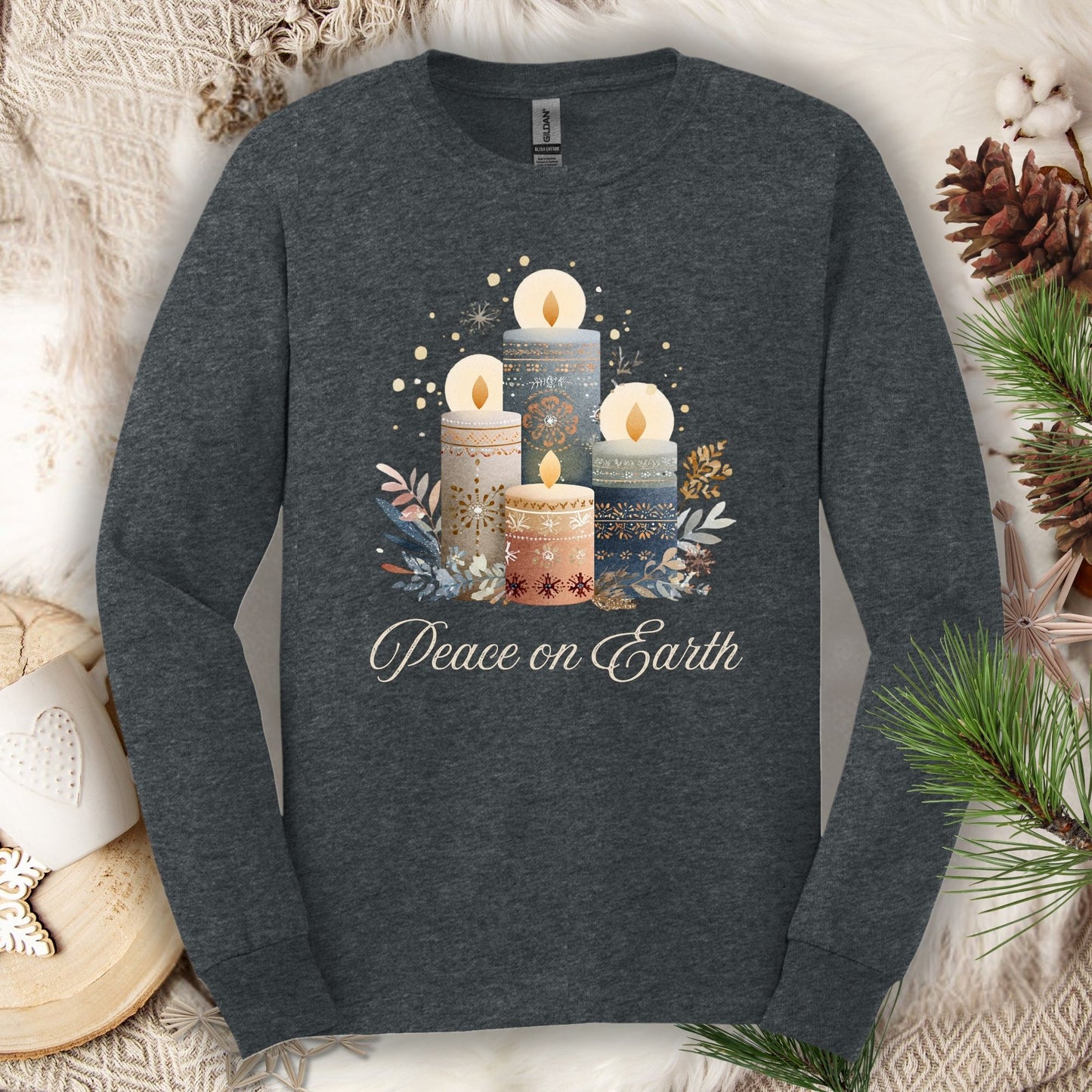 Dark Heather long sleeve tee with folk art Nordic advent candles and "Peace on Earth" text.