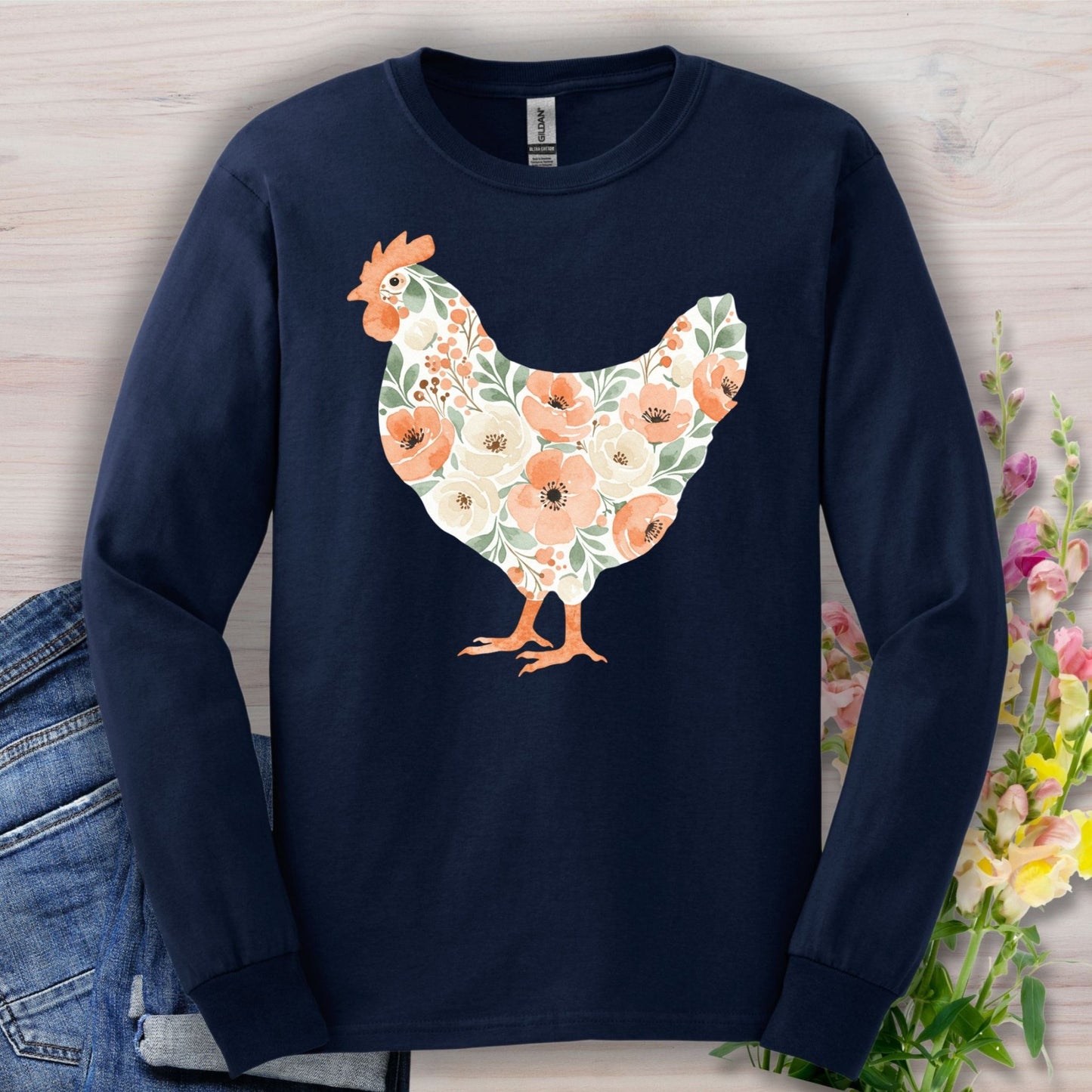 Navy long sleeve tee with a watercolor floral hen design in peach, cream, and green.