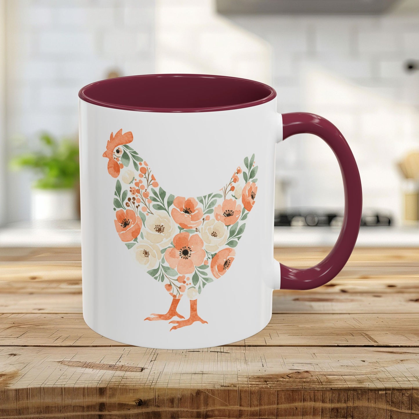 White 11oz ceramic mug with maroon handle/interior and a coral/sage floral chicken silhouette.