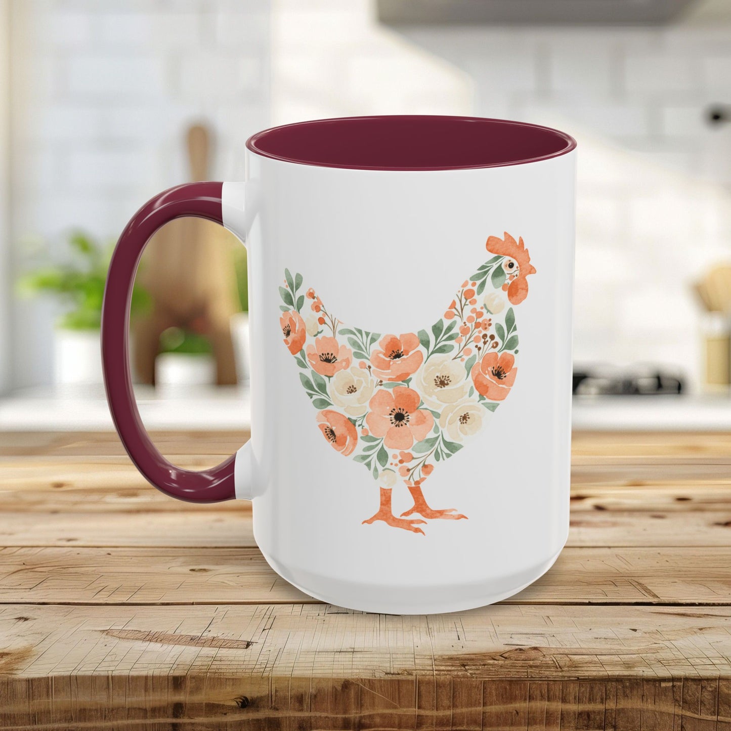 White ceramic mug with a maroon handle and interior, featuring a coral and sage floral chicken design.