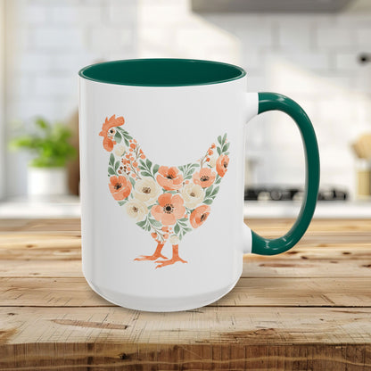 White 15oz ceramic mug with a green handle and interior, featuring a coral and sage floral chicken silhouette.