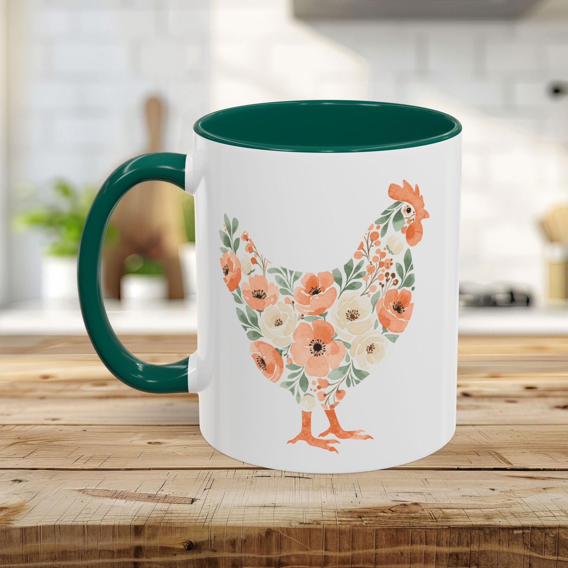 White ceramic mug with a dark green handle and interior, featuring a floral hen silhouette in coral and sage.