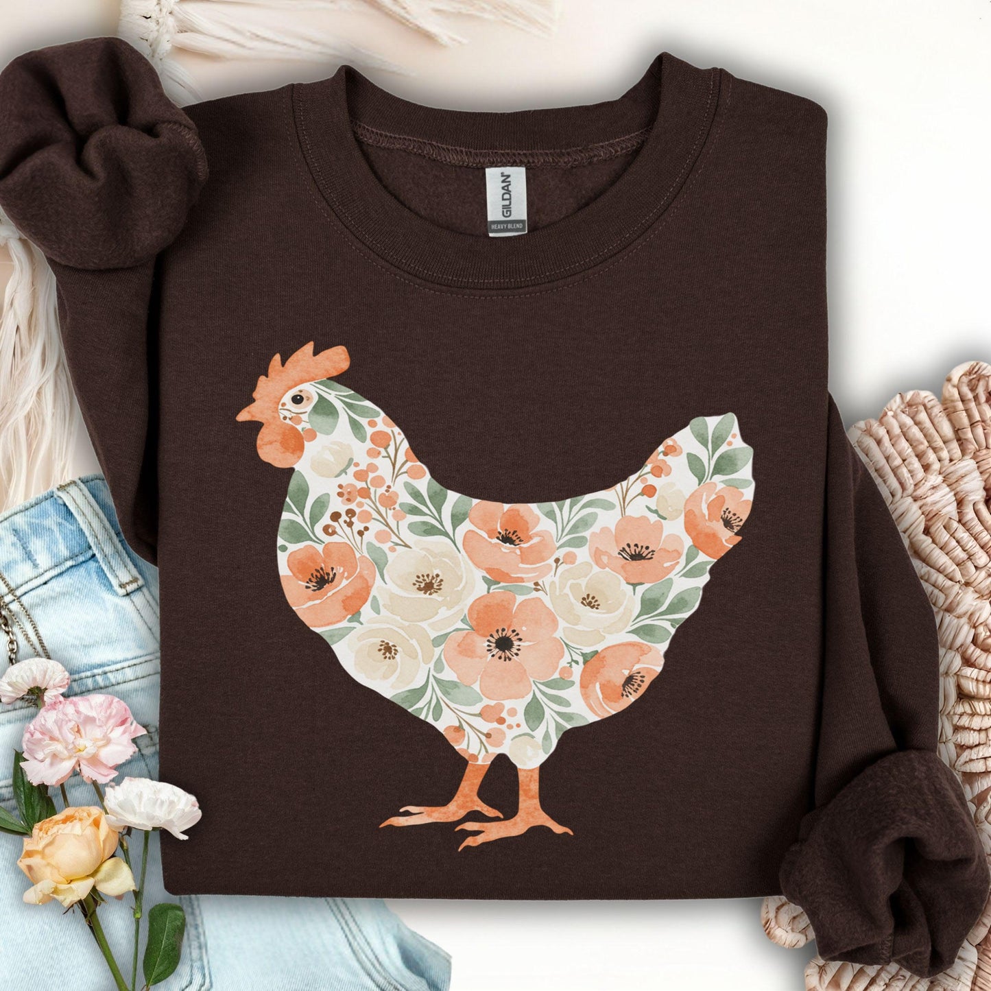 Dark chocolate S sweatshirt with a watercolor floral hen design in peach, cream, and green.