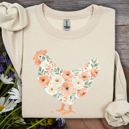 Sand sweatshirt with a watercolor floral hen design in peach, cream, and green.