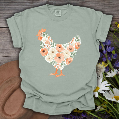 Bay S Comfort Colors t-shirt with a watercolor floral hen design in peach, cream, and green.