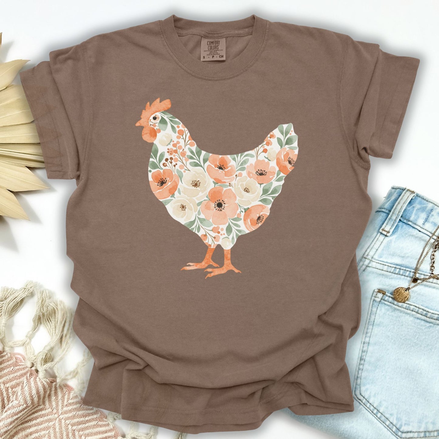 Espresso S t-shirt with a watercolor floral hen design featuring peaches and cream flowers.