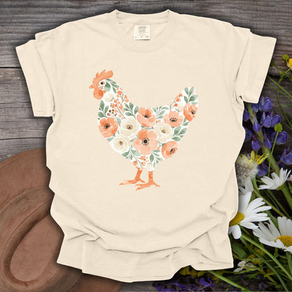 Ivory S t-shirt with a watercolor floral hen design, made from USA-grown cotton.