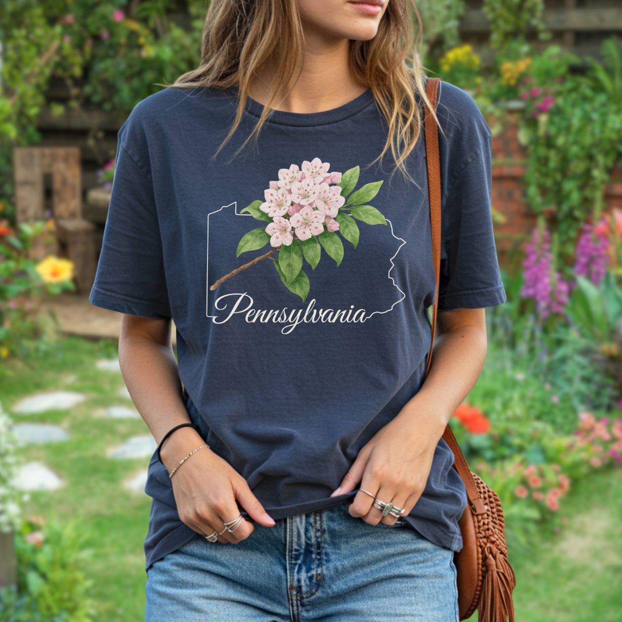 Navy garment-dyed t-shirt with pink mountain laurel blooms over a Pennsylvania outline.