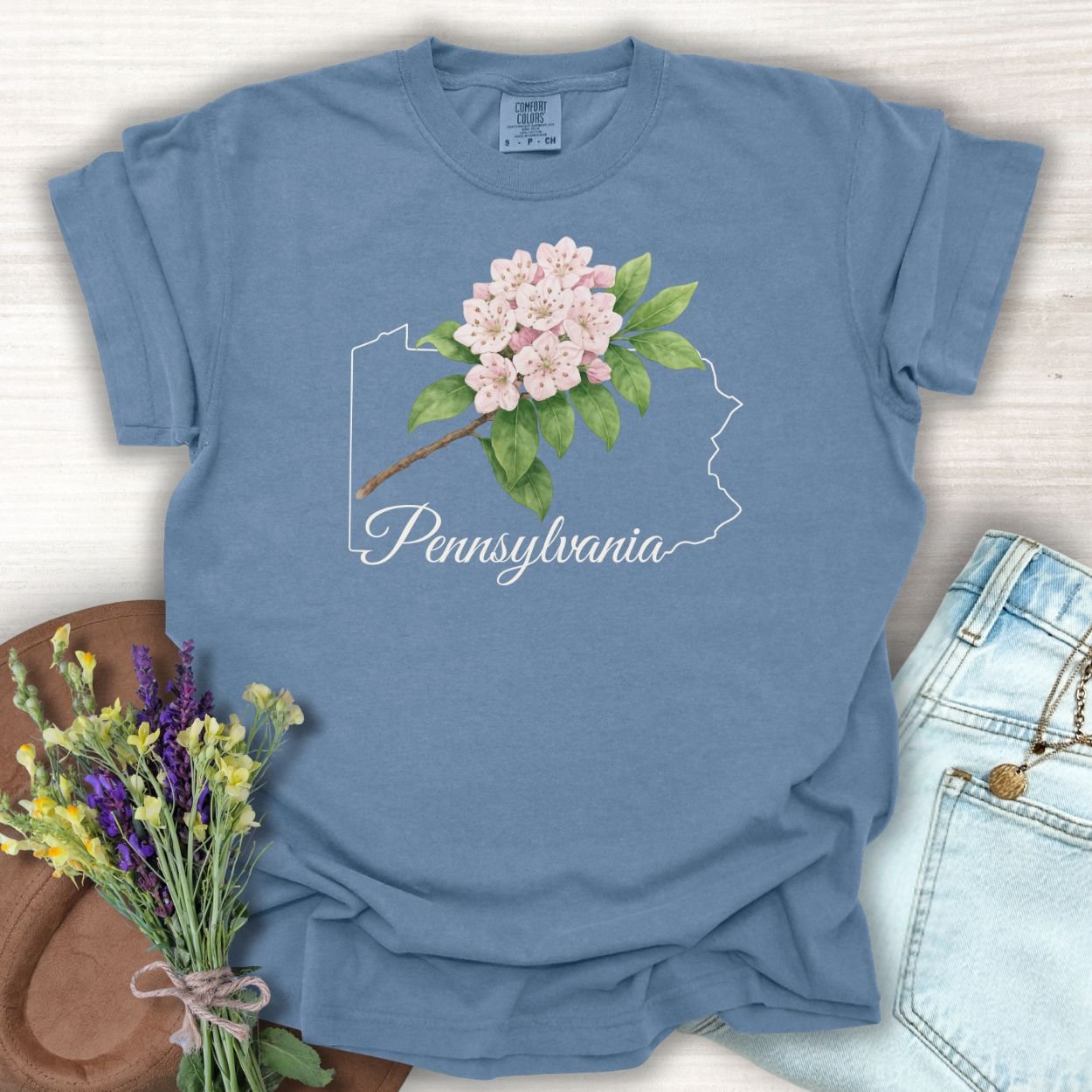 Blue Jean S t-shirt with pink mountain laurel blooms over a Pennsylvania outline and "Pennsylvania" text.
