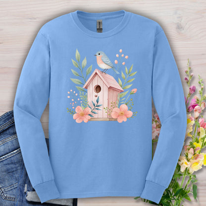 Carolina Blue long sleeve tee with a watercolor pink birdhouse, blue bird, and floral design.