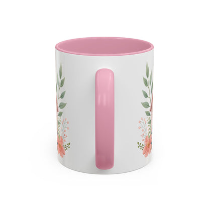 White ceramic mug with pink interior and handle, featuring a watercolor floral design.