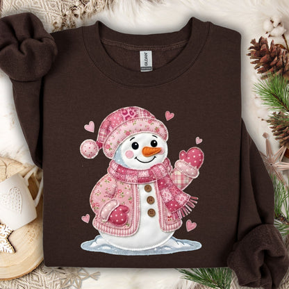 Dark chocolate heavy blend sweatshirt with a pink patchwork snowman and hearts design.
