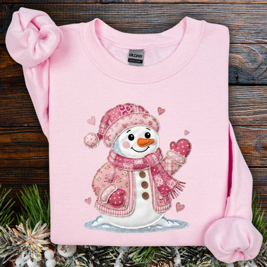 Light pink S heavy blend sweatshirt with a pink faux patchwork Valentine's snowman and hearts.