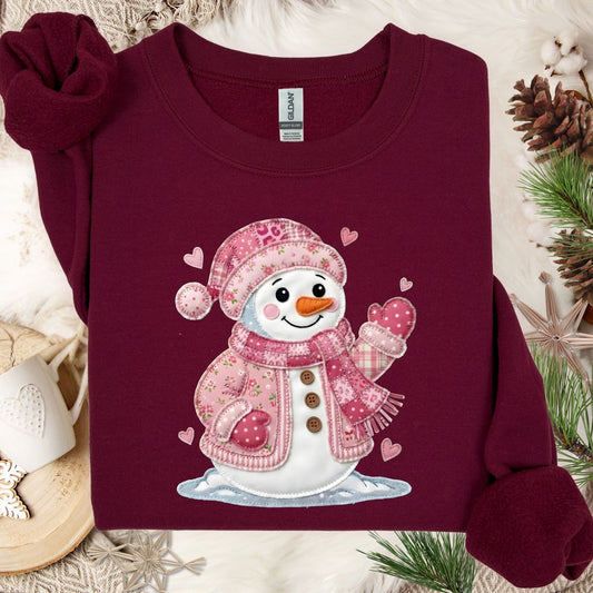 Maroon S heavy blend sweatshirt with a pink patchwork Valentine's snowman and hearts design.